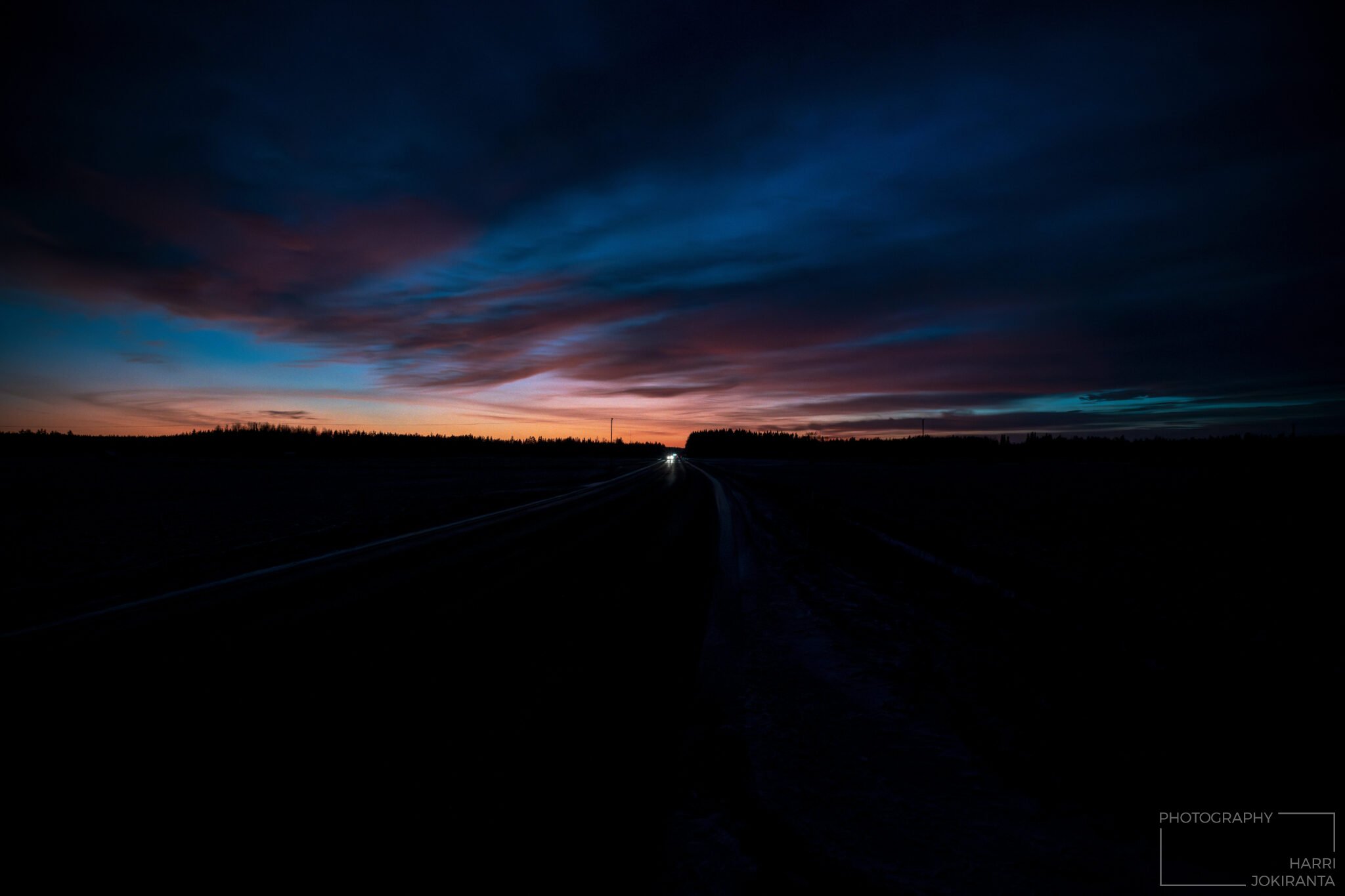Sunset at the end of dark road …